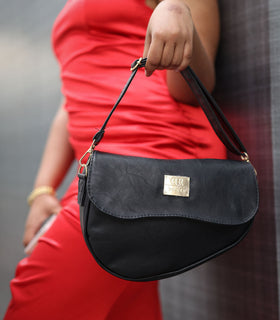 Denri Africa's black Montana Sling Bag. Classic black crossbody sling, simple and functional.