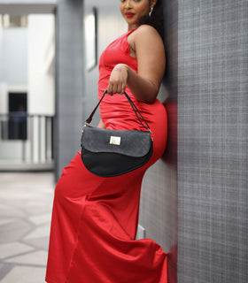 Denri Africa's black Montana Sling Bag. Urban black sling design, clean vegan leather, practical daily carry.
