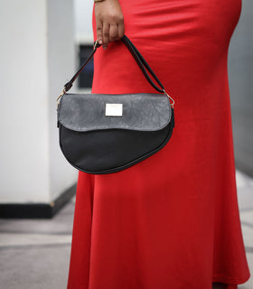 Denri Africa's black Montana Sling Bag. Stylish black sling handbag, compact essentials bag.