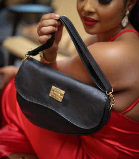 Denri Africa's black Montana Sling Bag. Classic black crossbody sling, durable vegan leather, everyday essentials.