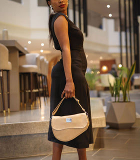 Denri Africa's beige Montana Sling Bag. Stylish neutral crossbody sling, durable build, modern look.