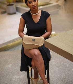 Denri Africa's beige Montana Sling Bag. Functional beige sling, comfortable wear design, ideal for commuting.