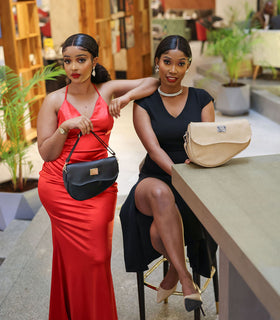 Denri Africa's black and beige Montana Sling Bags. Minimalist sling pairing, travel-ready vegan leather bags.