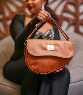 Denri Africa's spice Montana Sling Bag. Fashion spice sling purse, sleek and comfortable for on-the-go.