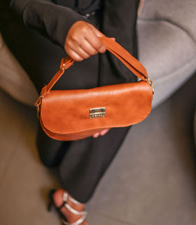 Denri Africa's spice Montana Sling Bag. Warm spice-colored sling purse, compact and functional, daily wear.