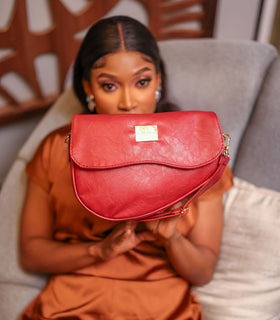 Denri Africa's red Montana Sling Bag. Elegant red sling bag, lightweight crossbody, perfect for on-the-go wear.