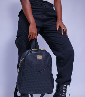 Denri Africa's black Monah Backpack. Functional black pack, spacious compartments, comfortable for long-day wear.