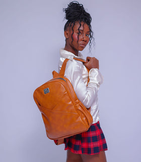 Denri Africa's caramel Monah Backpack. Caramel backpack with spacious storage, ergonomic design, practical daily bag.