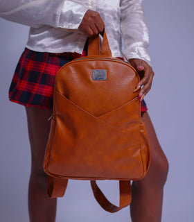 Denri Africa's caramel Monah Backpack. Stylish caramel backpack, roomy compartments, comfortable shoulder straps.