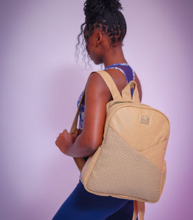 Denri Africa's beige Monah Backpack. Versatile beige backpack, subtle tone, functional for day-to-day school or office use.