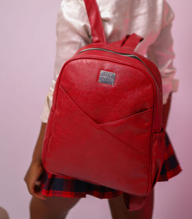 Denri Africa's red Monah Backpack. Red everyday backpack, spacious storage, durable straps, versatile urban bag.