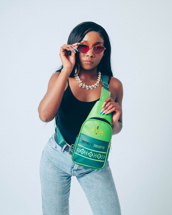 Denri Africa’s green Denri x Manyatta Crossbody Bag. Slim crossbody bag, deep green finish, practical hands-free carry for daily essentials.