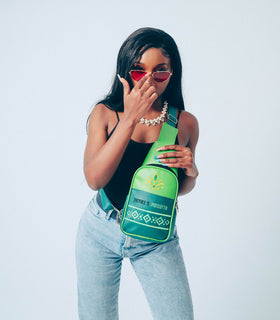 Denri Africa’s green Denri x Manyatta Crossbody Bag. Minimalist green vegan-leather sling, compact chest bag, ideal for commuting or travel.