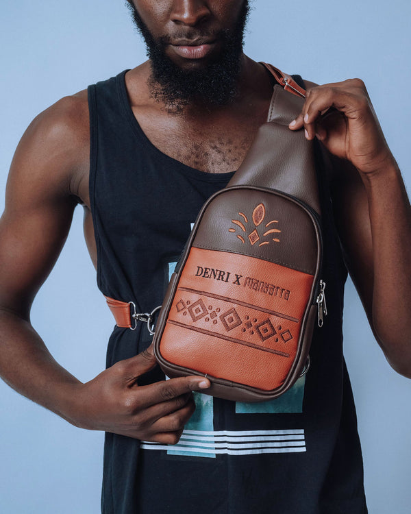Denri Africa’s brown Denri x Manyatta Crossbody Bag. Urban crossbody sling bag, minimalist vegan leather, perfect for travel and daily essentials.